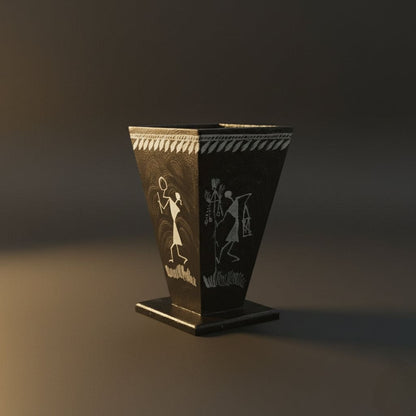 black Pen holder with white warli art on it