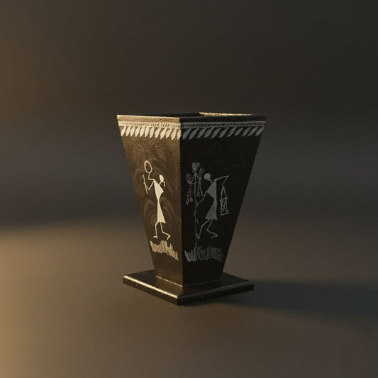 black Pen holder with white warli art on it