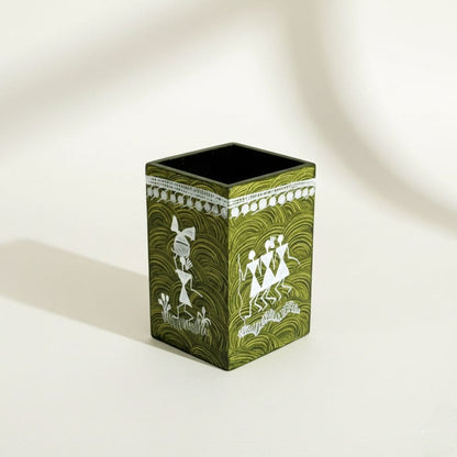 Green decorative pen holder  box with white patterns on a light background